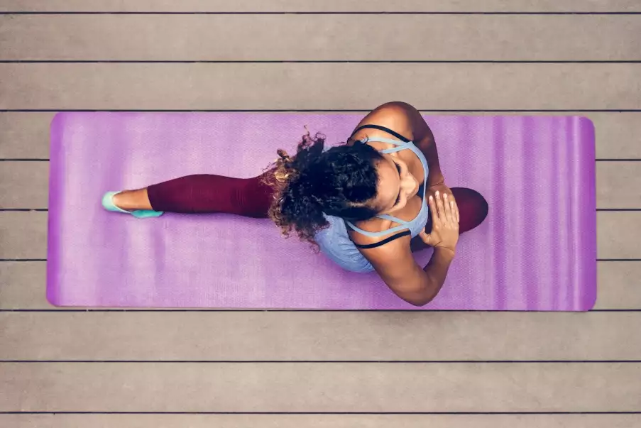young woman demonstrating the yoga health benefits