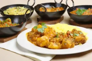 a variety of curry dishes sharing a base curry gravy