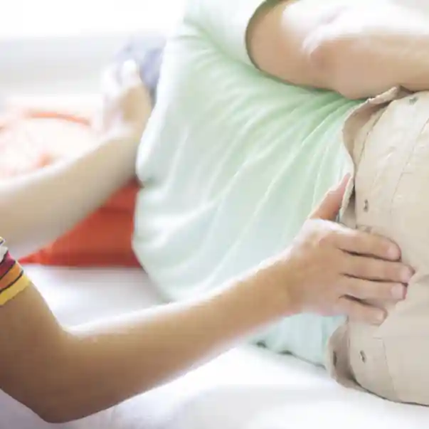 sidelying male receiving cranial osteopathy