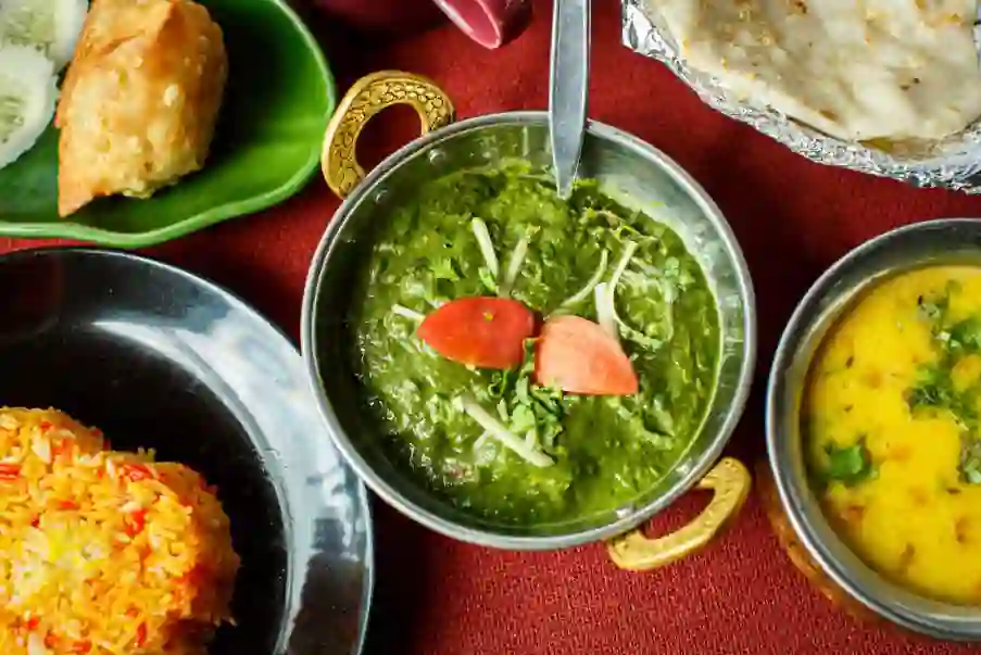 a selection of indian vegetable bhajis made from curry gravy