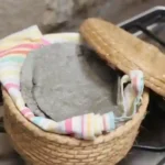 blue corn tortillas kept warm in a basket - chiquihuite, with colourful tea-towel