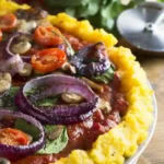 nixtamalized corn pizza-tamal with tomato sauce and vegetable toppings