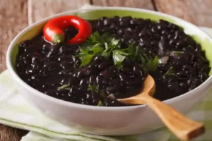recipe for Mexican black beans served in an earthenware dish