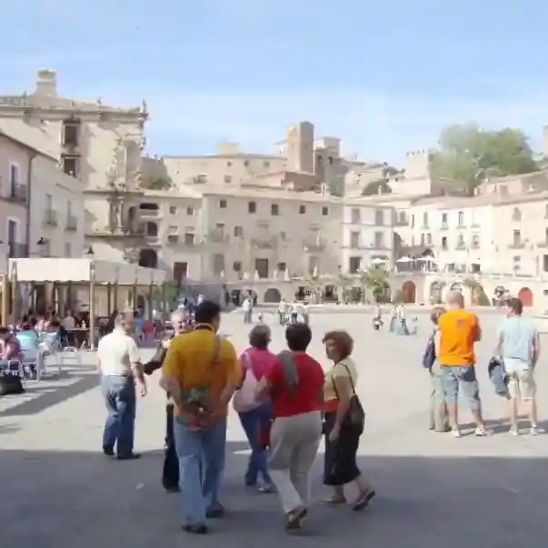 Participants on a therapeutic yoga holiday enjoying Trujillo's town square, one of Extremadura's most theatrical